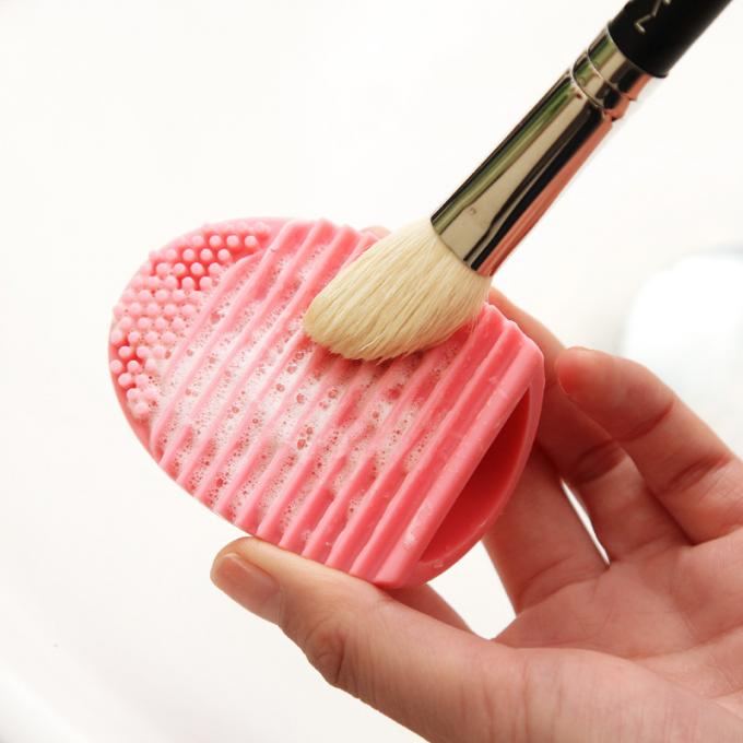 Color purpúreo claro del maquillaje del silicón de la belleza de cepillo del limpiador de la forma diaria del huevo